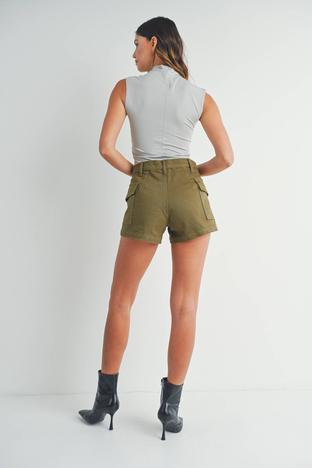 Olive cargo shorts - close-up of stretch fabric and pocket