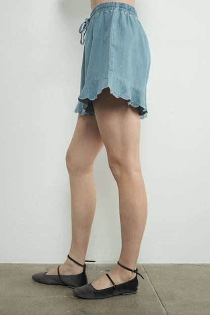 CHAMBRAY EMBROIDERED RUFFLE HEM SHORTS