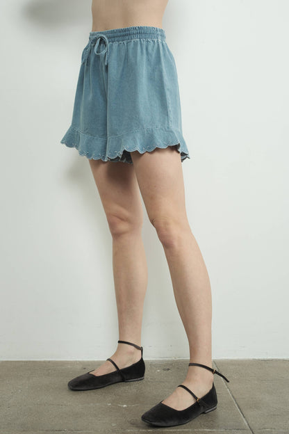 CHAMBRAY EMBROIDERED RUFFLE HEM SHORTS